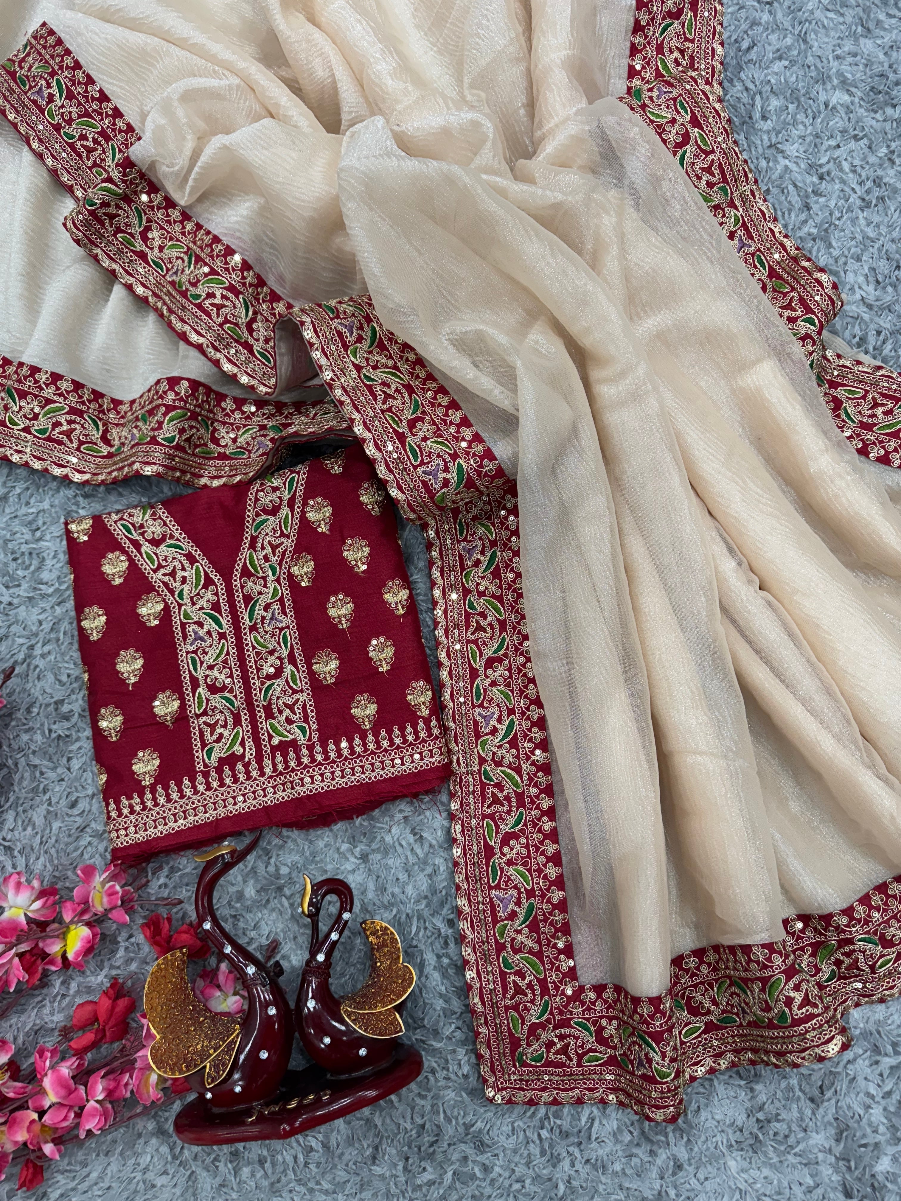 कढ़ाई और लेस बॉर्डर वाली डिज़ाइनर पार्टी वेयर साड़ी